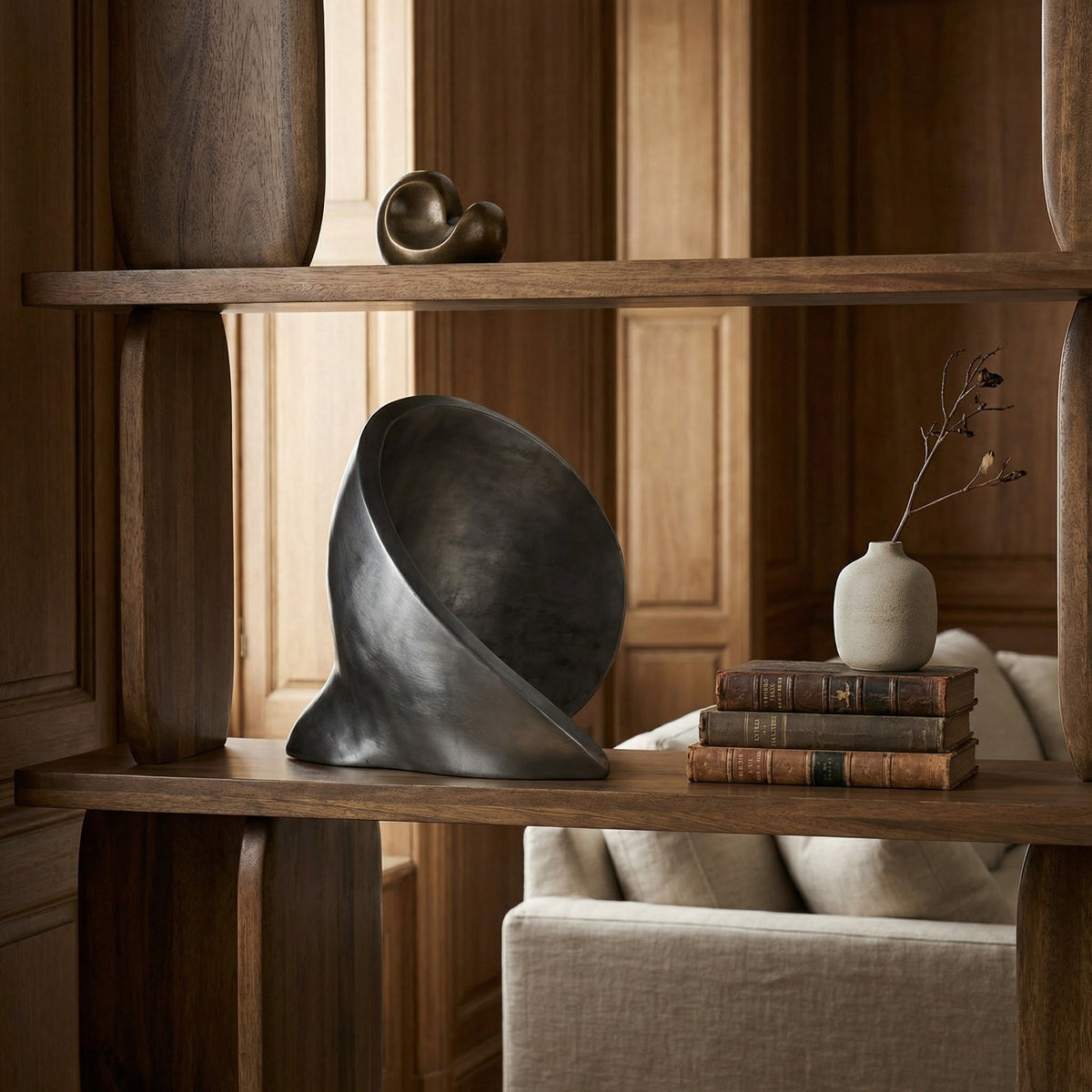 Noir Sheila Sculpture Brushed Silver styled in an interior setting