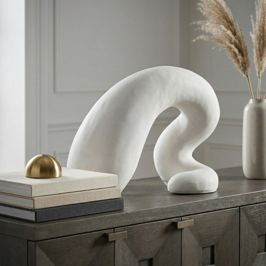 Noir Fisnik Sculpture White styled in an interior setting