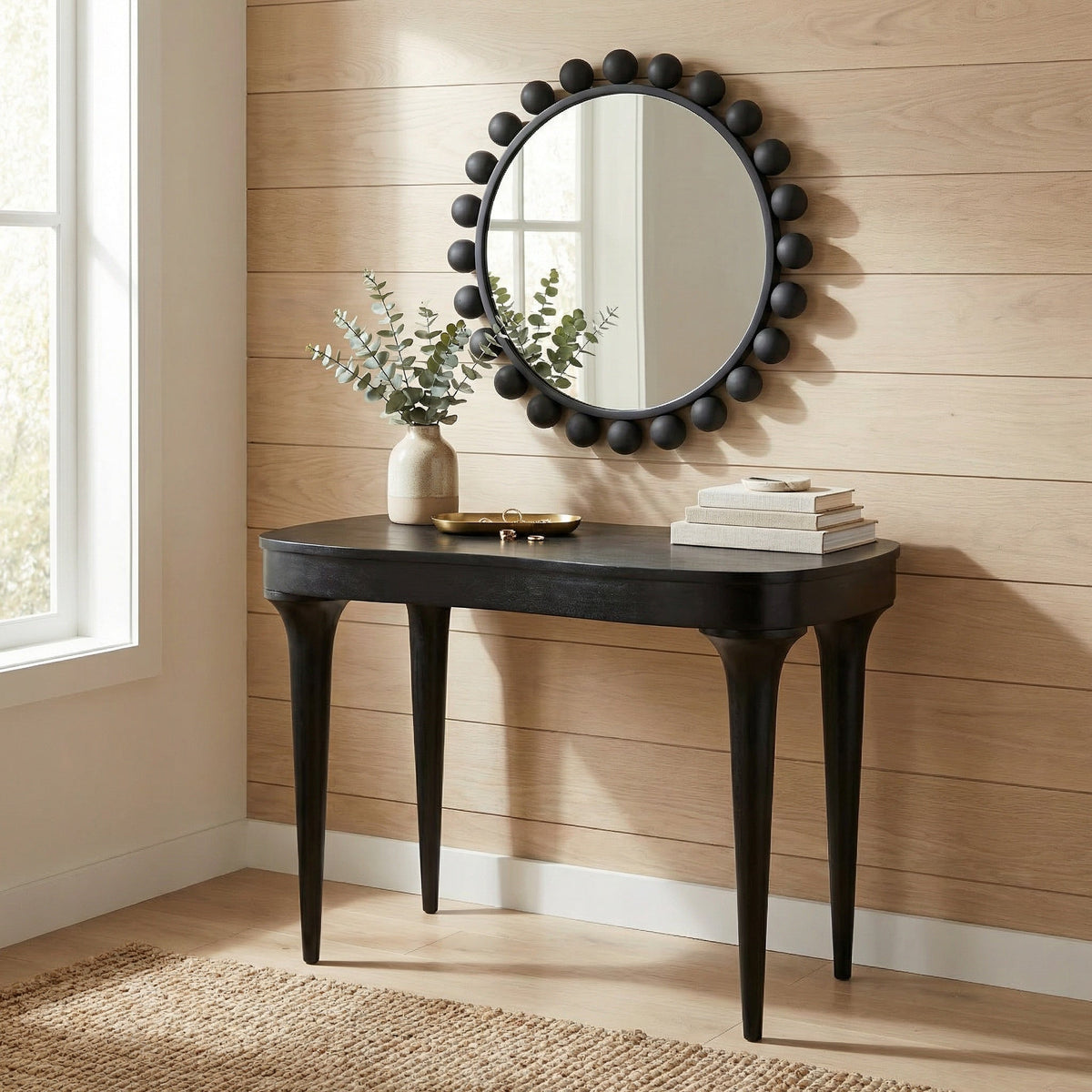 Noir Rennie Desk Hand-Rubbed Black styled in an interior setting
