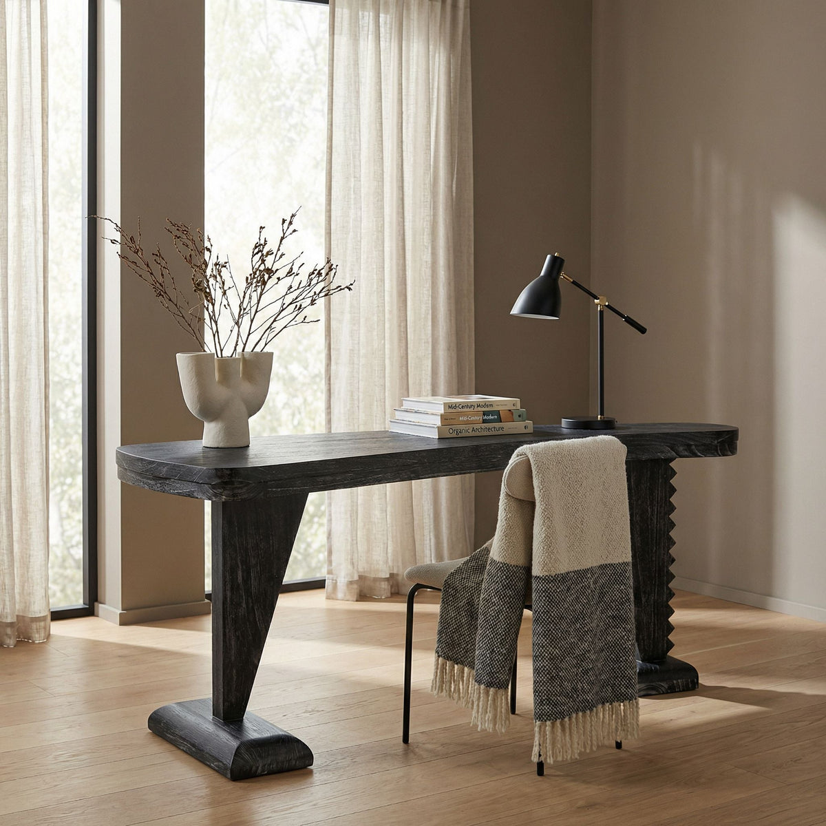 Noir Zigmund Desk Cinder Black styled in an interior setting