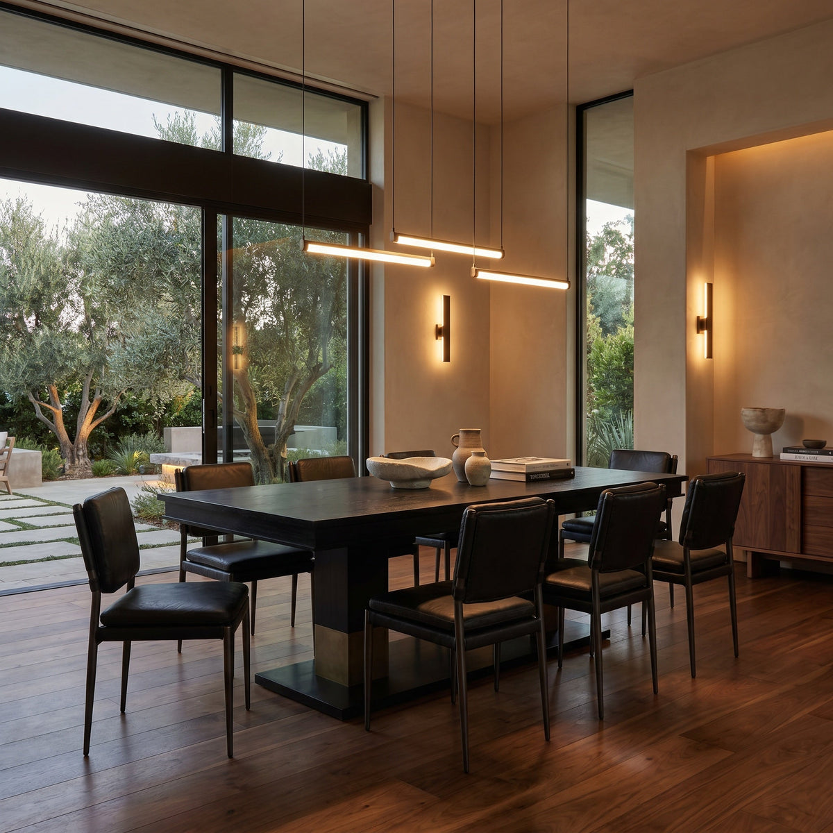 Noir Ravenko Dining Table Hand-Rubbed Black, Brass shown in a styled room setting