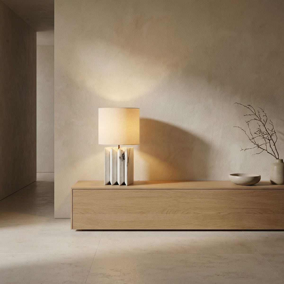 Noir Jman Lamp With Silk Shade White Marble styled in an interior setting