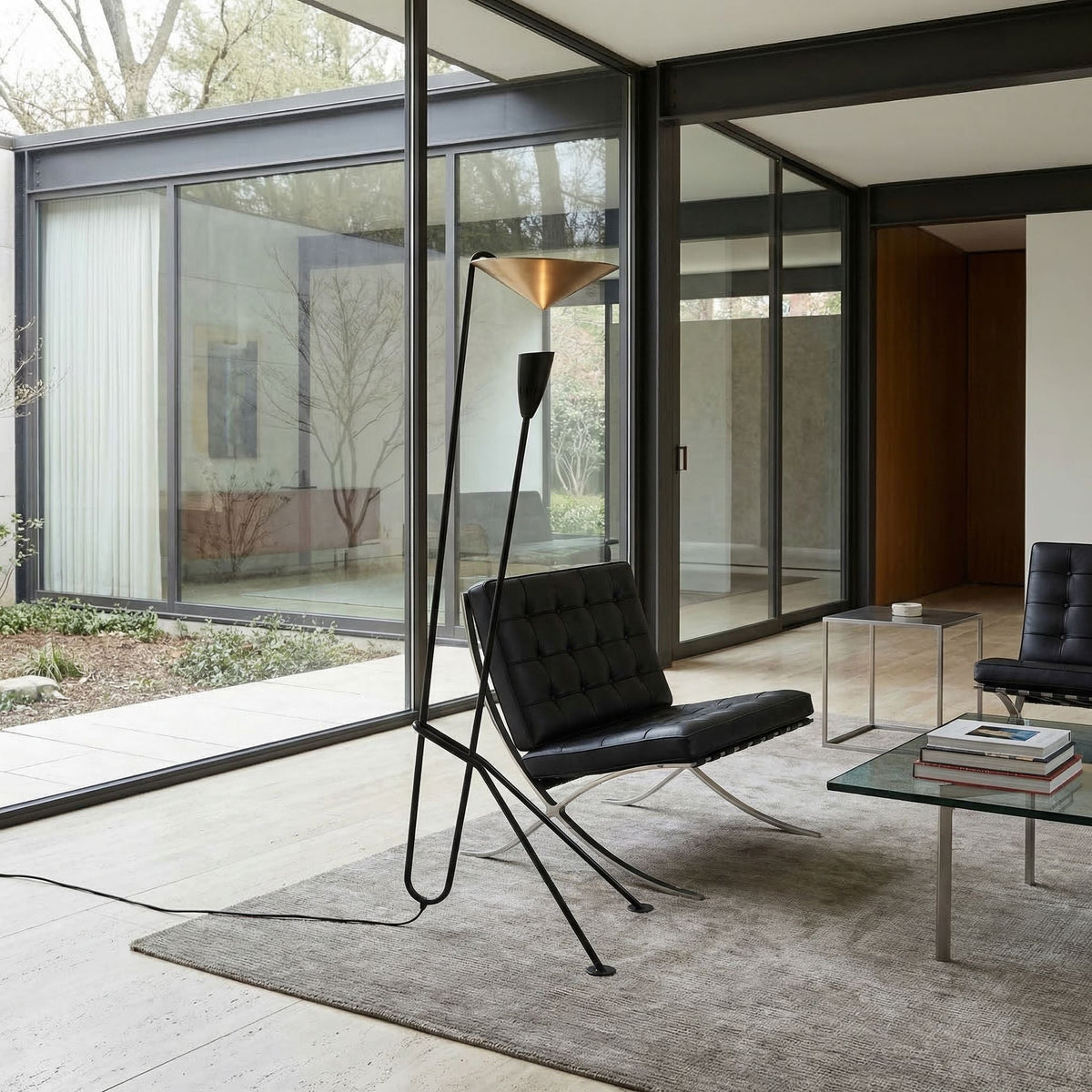 Noir Jetset Floor Lamp Matte Black, Antique Brass styled in an interior setting