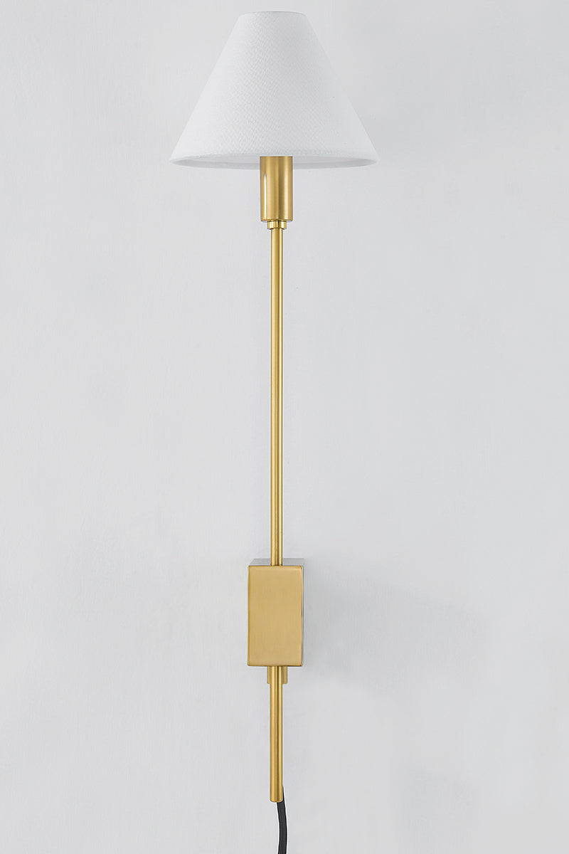 Hudson Valley Teaneck Plug-In Wall Sconce in Aged Brass, room setting 1