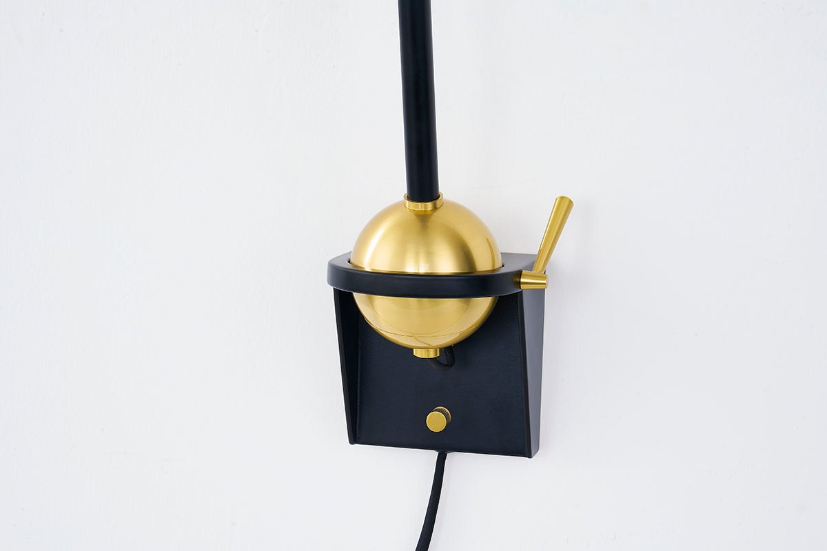 Hudson Valley Winsted Plug-In Wall Sconce in Aged Brass / Soft Black, room setting 2