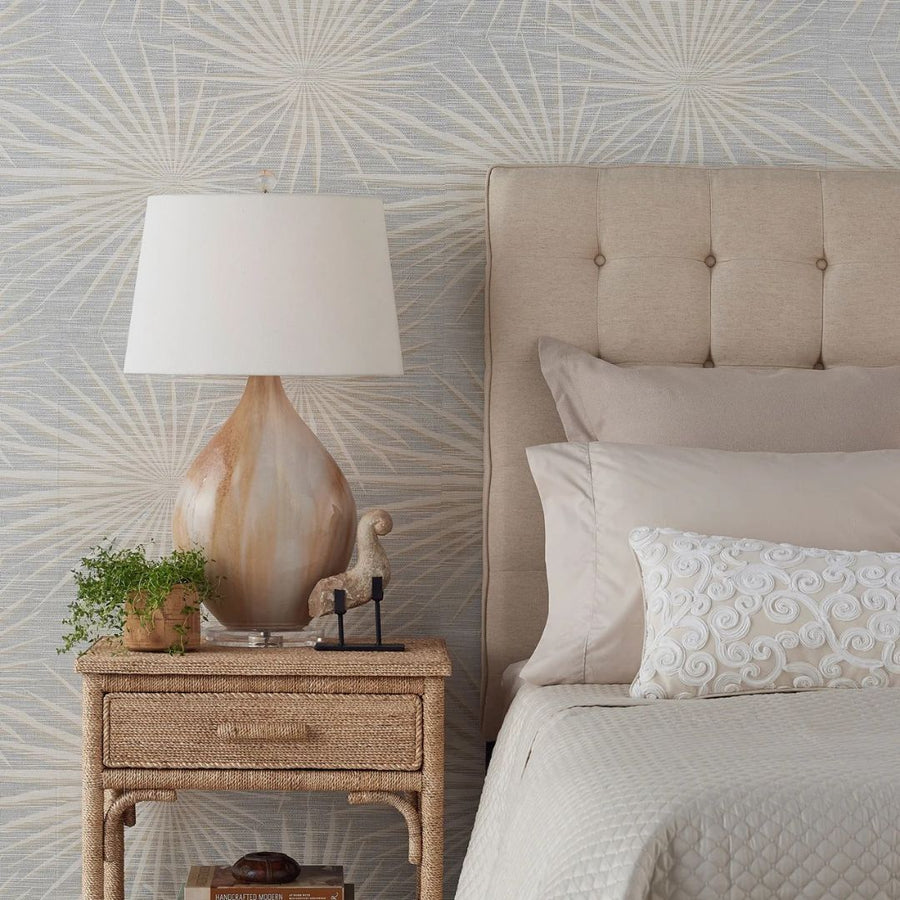 Opal Table Lamp styled on a rattan nightstand with decorative accents beside a fully made bed.