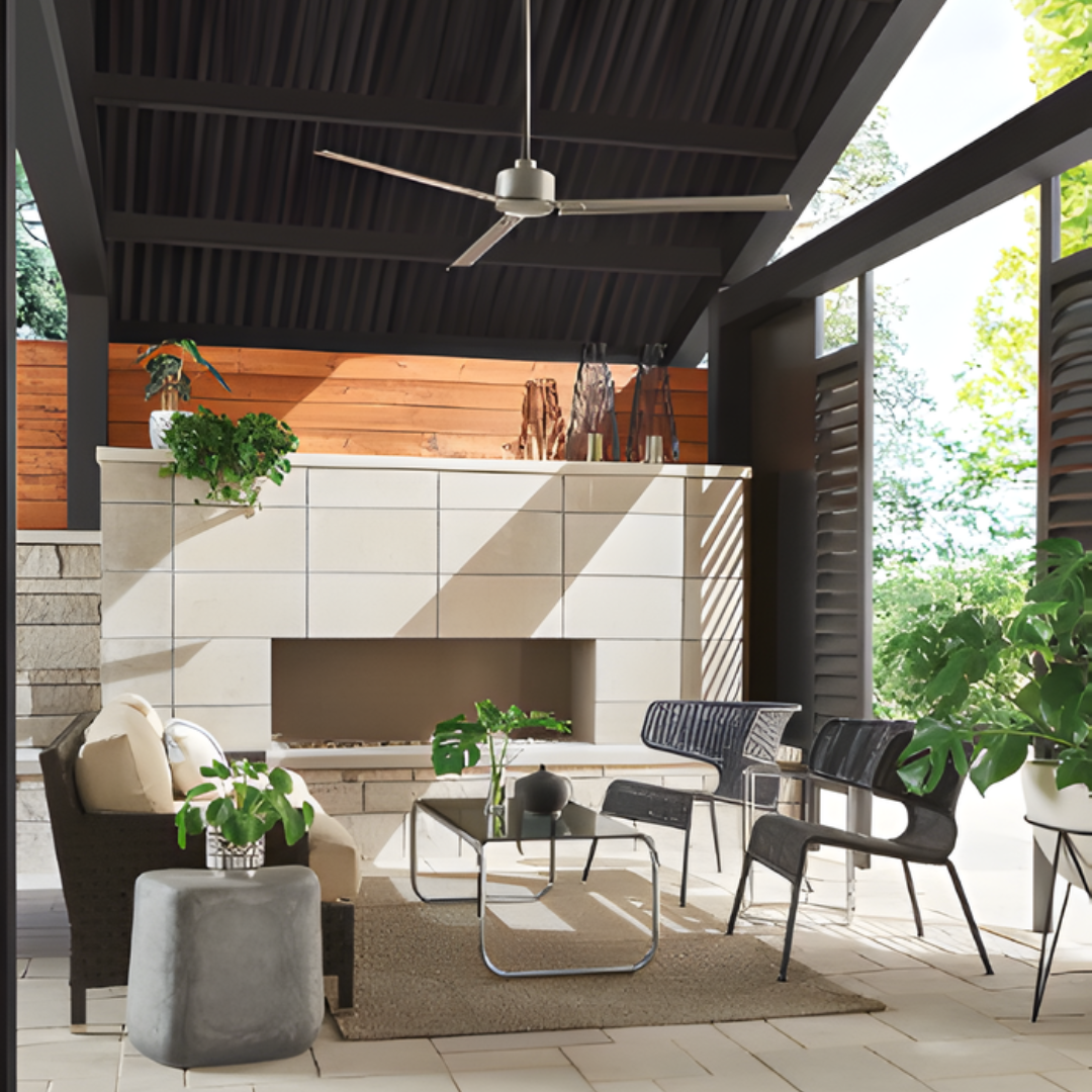 Indy ceiling fan styled on an exterior patio with seating, a coffee table, and a fireplace.