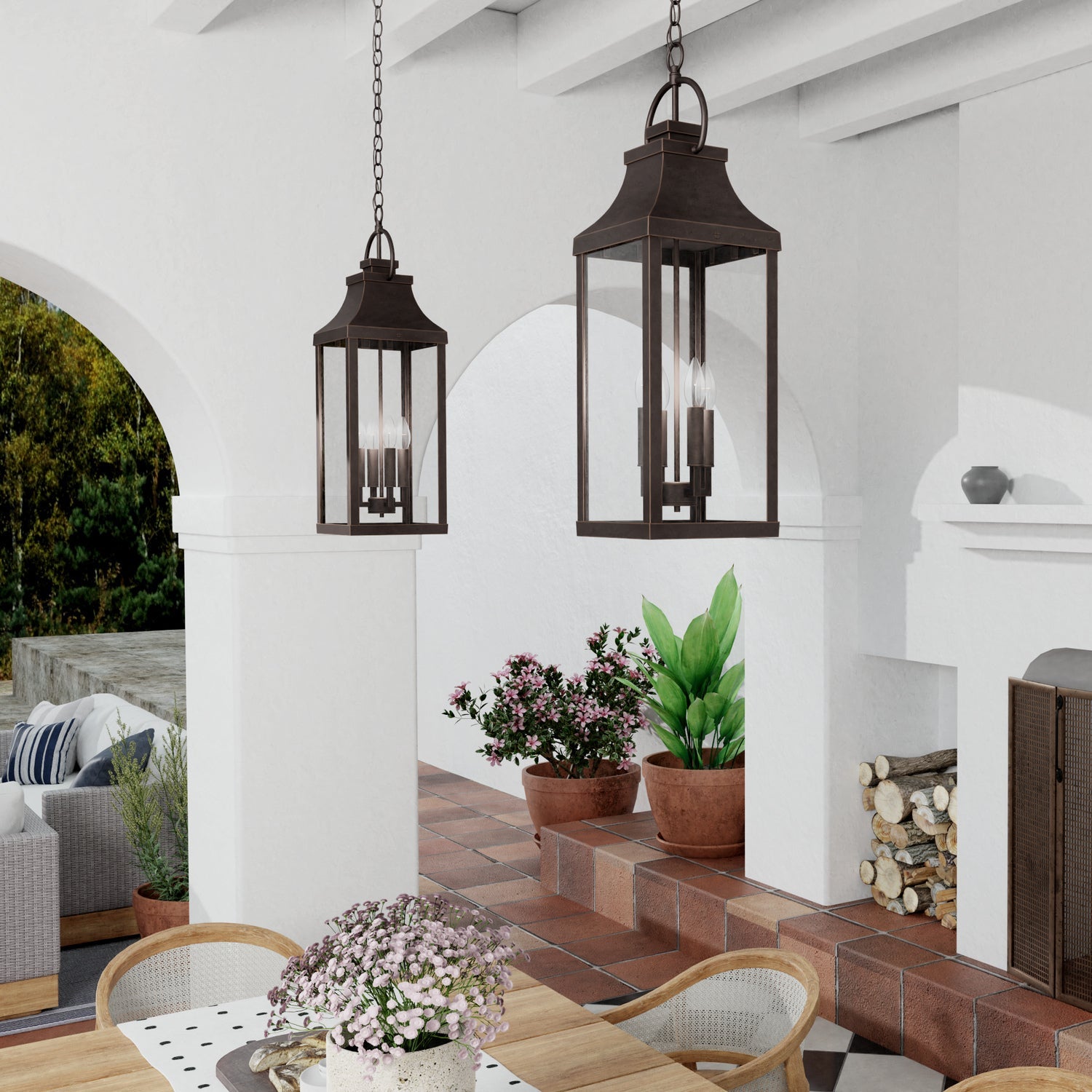 A pair of Bradford Pendants styled over an outdoor patio dining table and chairs.