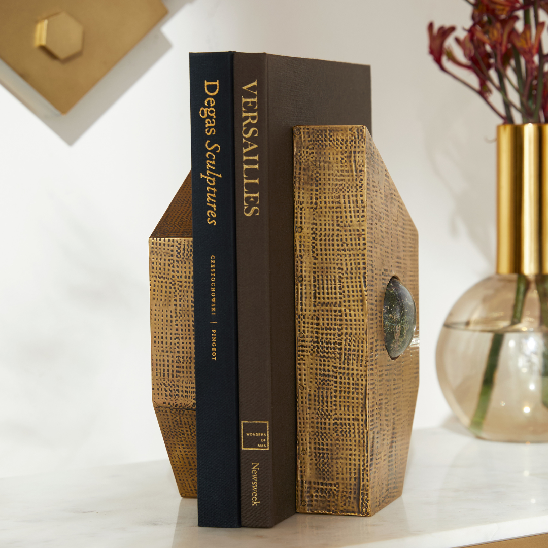 Garrick Bookends, Set of 2 styled with two books centered on a marble console table, accompanied by a vase of flowers to the right.
