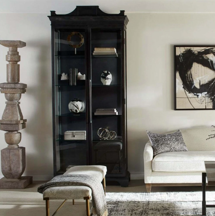 Bethlem Cabinet styled in a contemporary sitting room alongside benches and a sofa.
