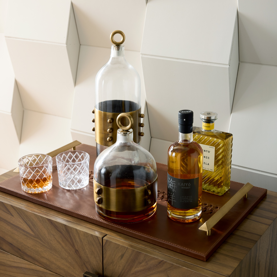 Hancock Decanters, Set of 2 styled with two rocks glasses and spirits, arranged on top of the Hillebrandt Tray.