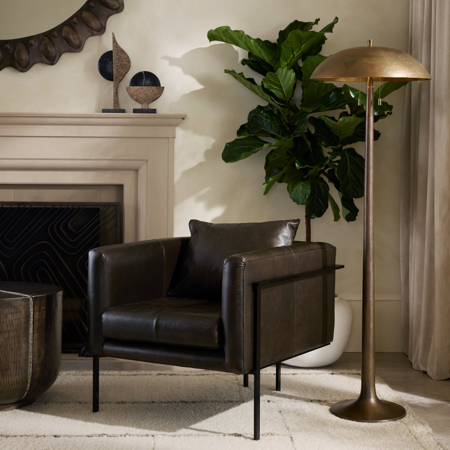 Fleetwood Floor Lamp styled beside a modern leather chair, with a large potted fiddle leaf fig positioned behind it.