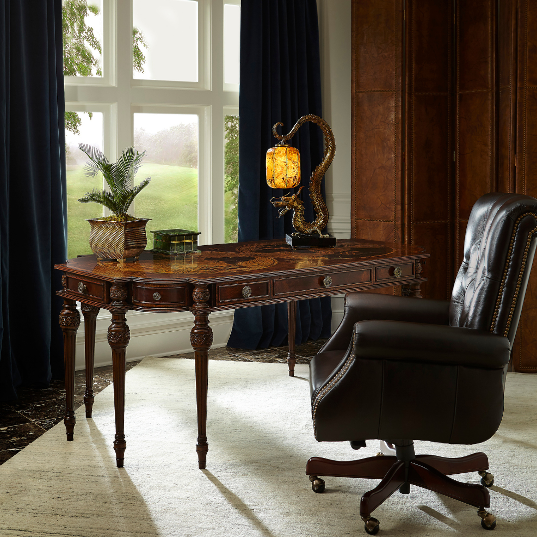 Kramer Office Chair styled in a traditional office setting with a dark wood desk topped with decorative items.