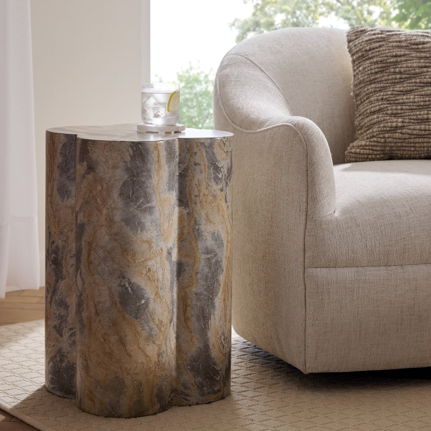 Harlow Accent Table placed beside a contemporary ivory chair, topped with a rocks glass for a refined finishing touch.