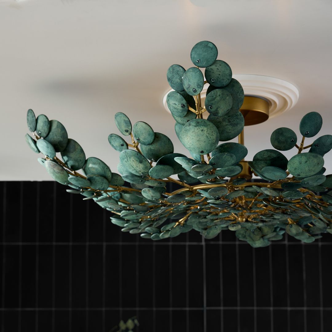 Close-up of the Bilal semi-flush mount set against an ivory ceiling with a contrasting black wall in the background.