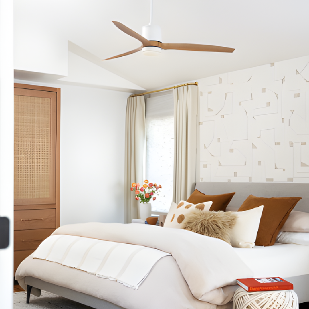 Hover 3-Blade Ceiling Fan styled in the center of a bohemian bedroom, featuring ivory bedding with colorful accents for a cozy ambiance.