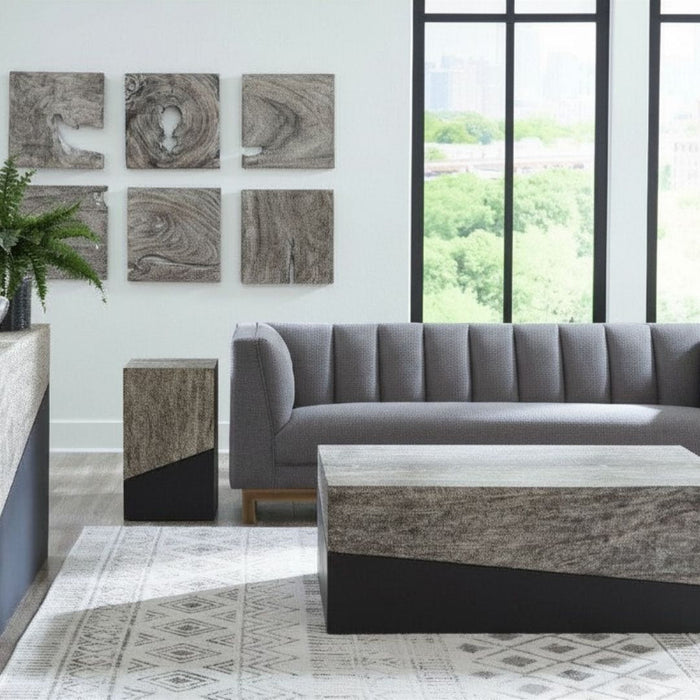 Geometry Small Coffee Table in a graystone and black finish styled within a modern organic sitting room.
