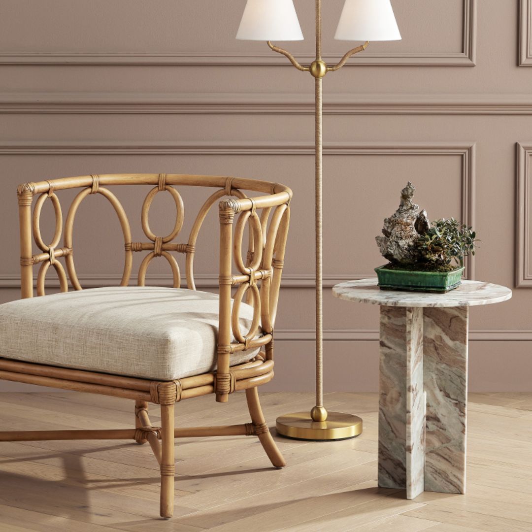 Tegal Natural Chair styled beside an occasional side table, with a floor lamp positioned behind it.