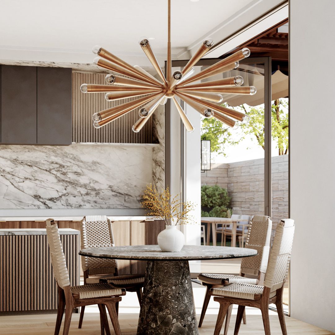 Keanu Chandelier suspended above a stone dining table, surrounded by four contemporary dining chairs.