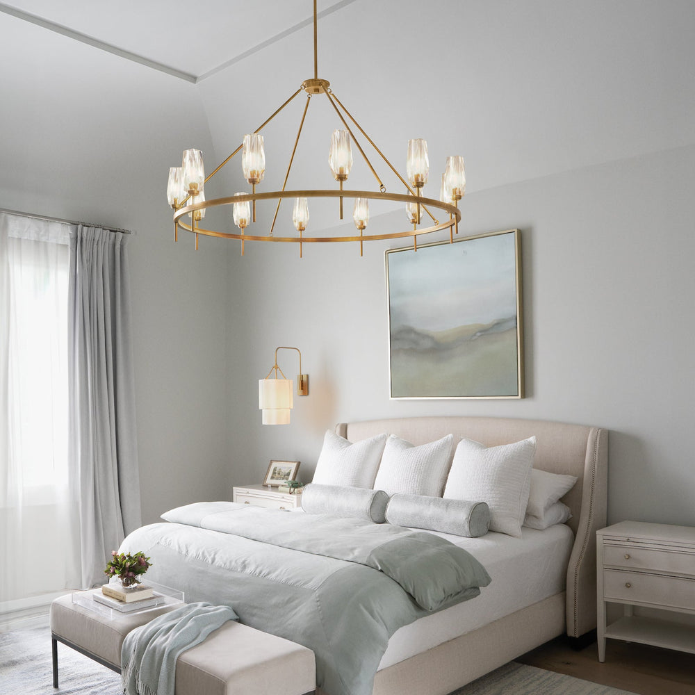 Transitional bedroom with a chandelier, bed, and side table.