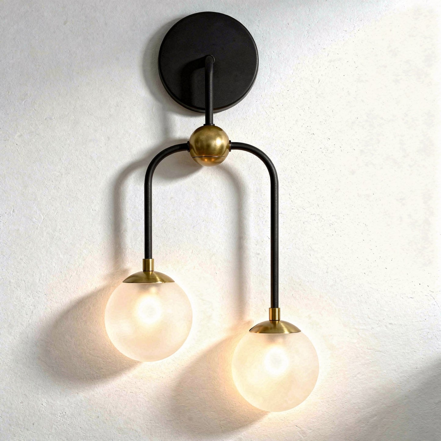 Couplet 2-Light Wall Sconce in Matte Black with Warm Brass Accents