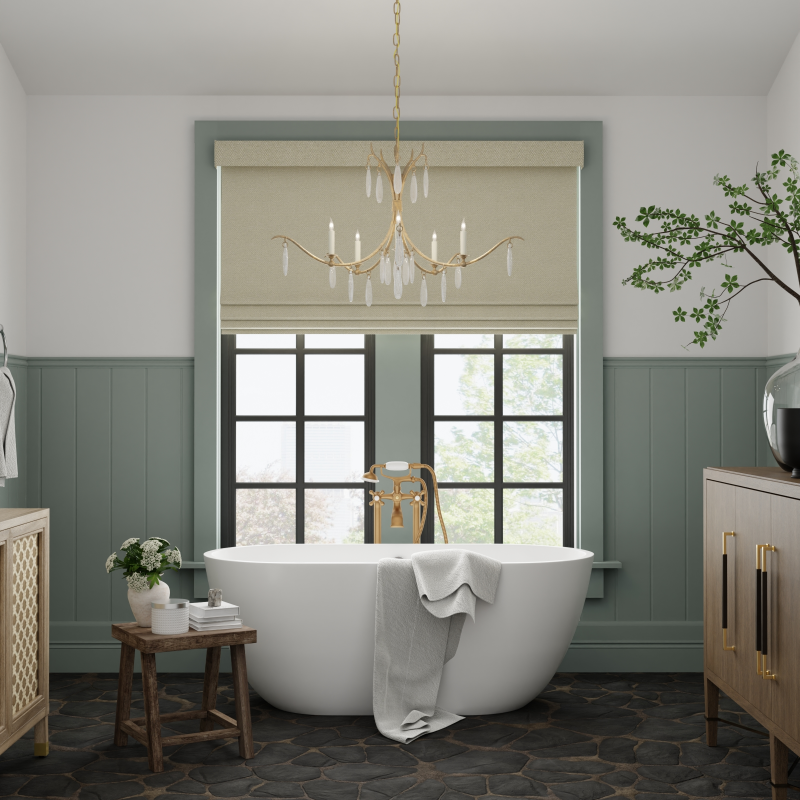 Contemporary style bathroom with freestanding bathtub, chandelier, and decorative elements.