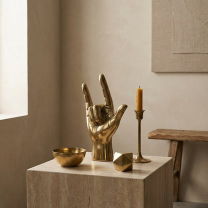Noir I Love You Sculpture Antique Brass styled in an interior setting
