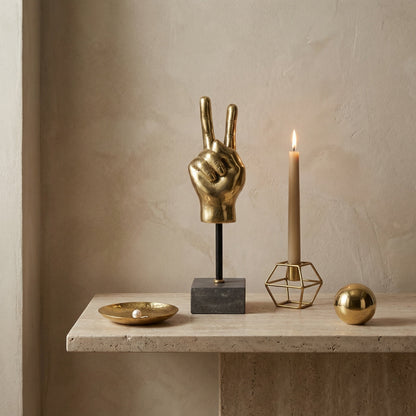 Noir Peace Sign On Stand Sculpture Antique Brass, Matte Black styled in an interior setting