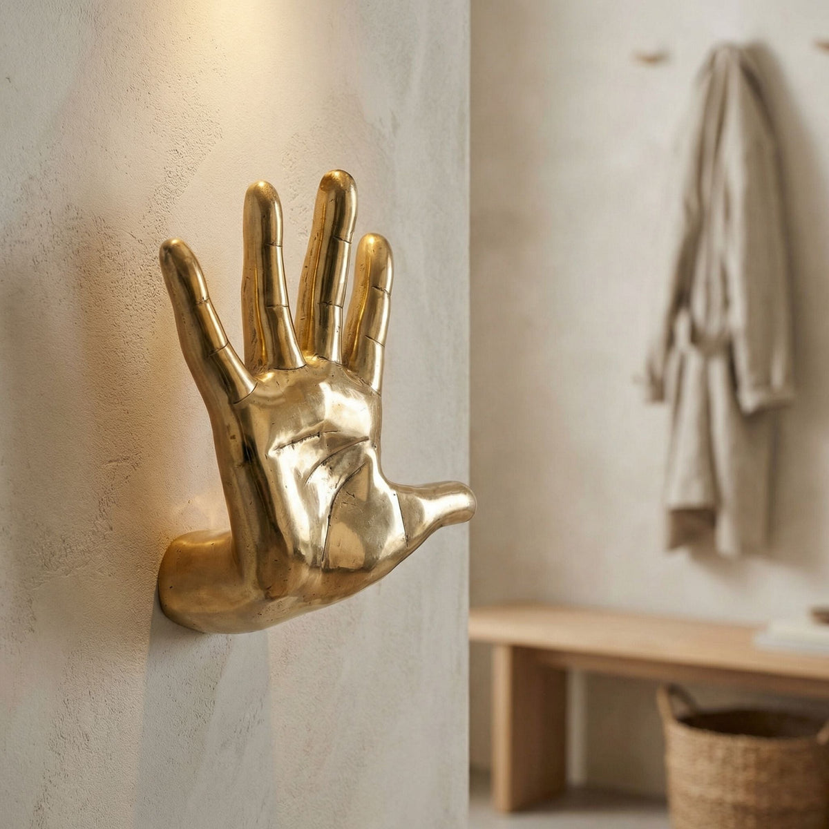 Noir Hand On The Wall Sculpture Antique Brass styled in an interior setting