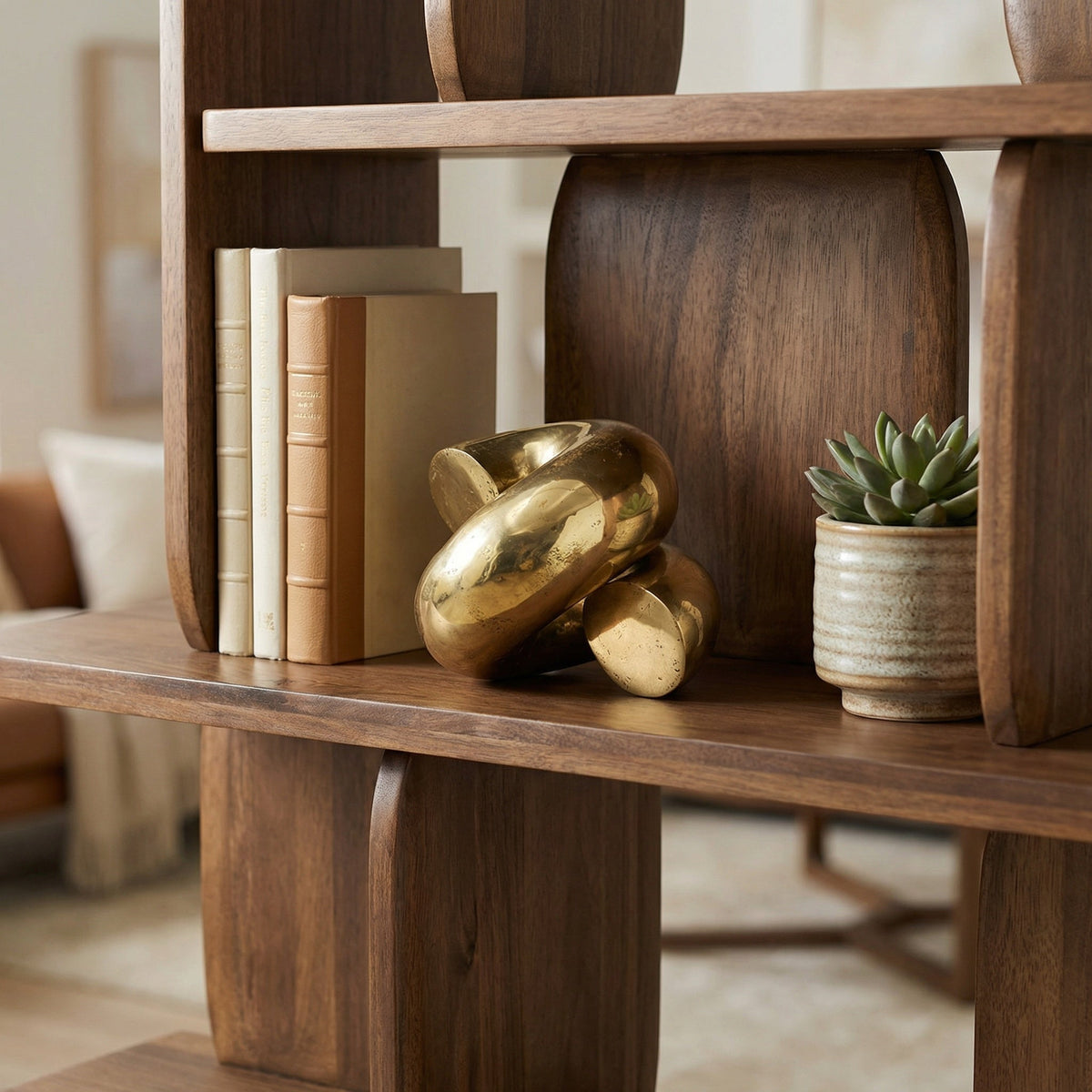 Noir Coiled Sculpture Antique Brass styled in an interior setting