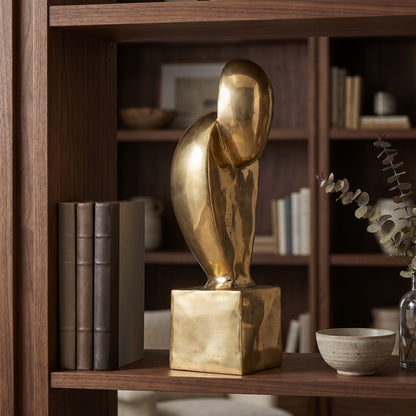 Noir Ripley Sculpture Antique Brass styled in an interior setting