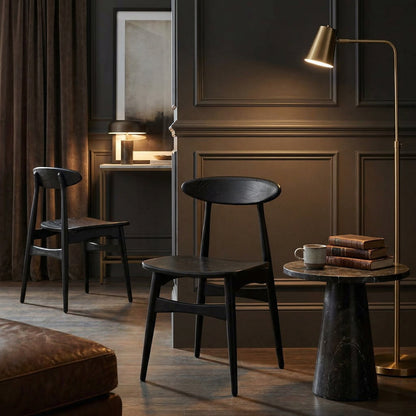 Noir Surf Dining Chair Charcoal Black styled in an interior setting