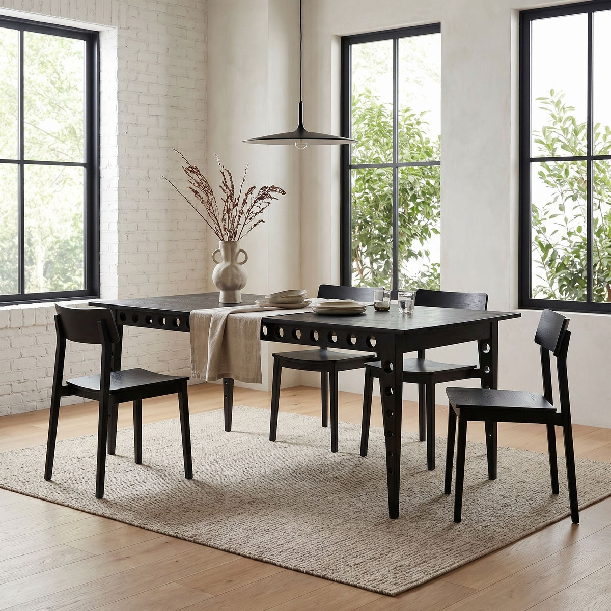 Noir Pericles Dining Table Black Charcoal styled in an interior setting