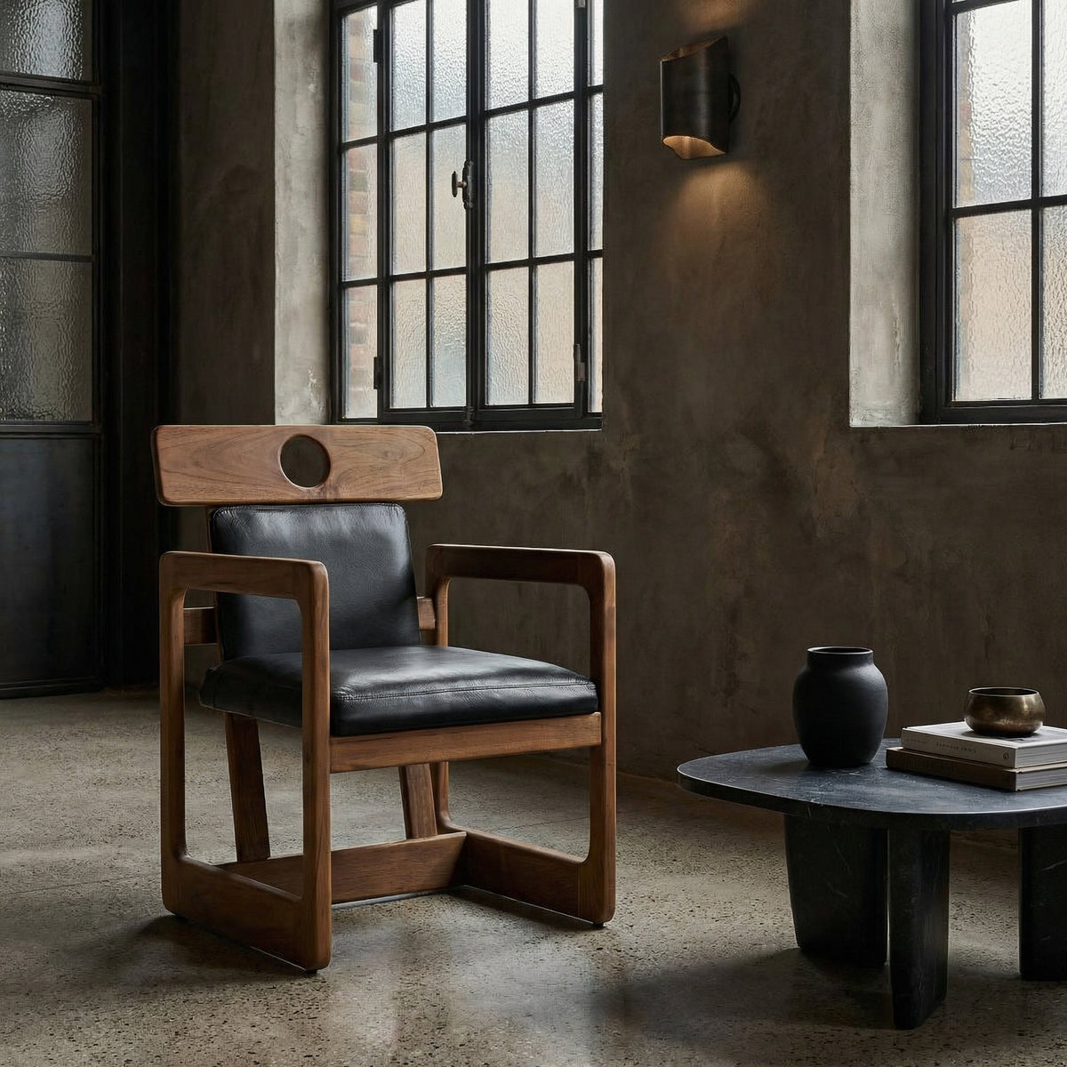 Noir Buraco Chair Natural, Black styled in an interior setting