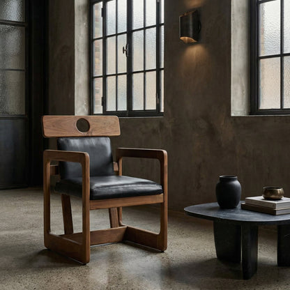 Noir Buraco Chair Natural, Black styled in an interior setting