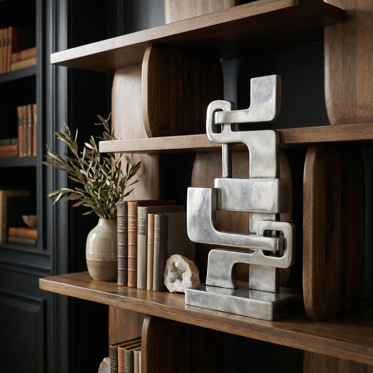 Noir Kubric Sculpture Polished Silver styled in an interior setting