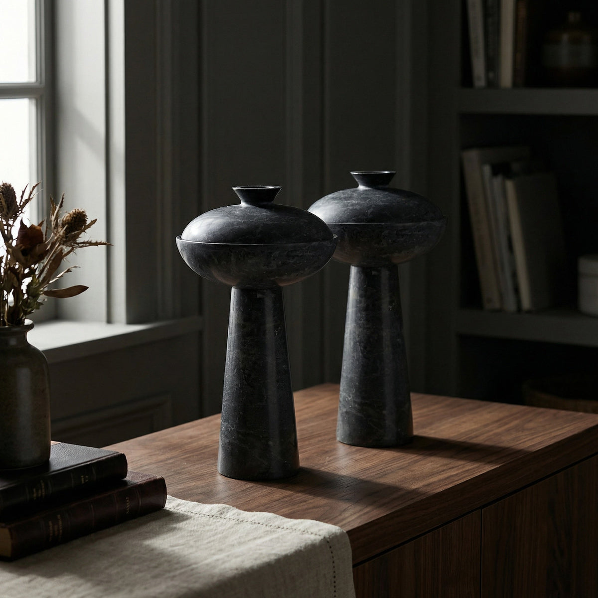 Noir Guy Sculpture Black styled in an interior setting