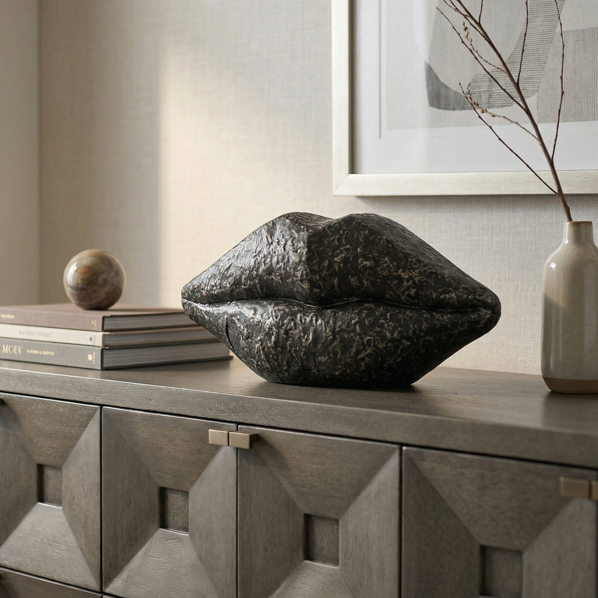 Noir Lips Sculpture Black styled in an interior setting