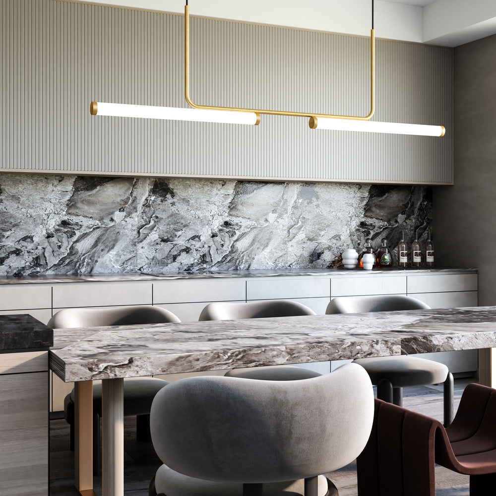 Modern dining area with marble table, modern linear chandelier, and chairs, featuring a marble backsplash.