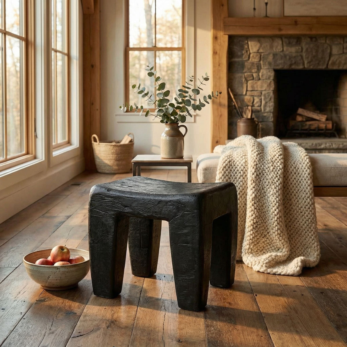 Noir Sumo Stool Burnt Black styled in an interior setting