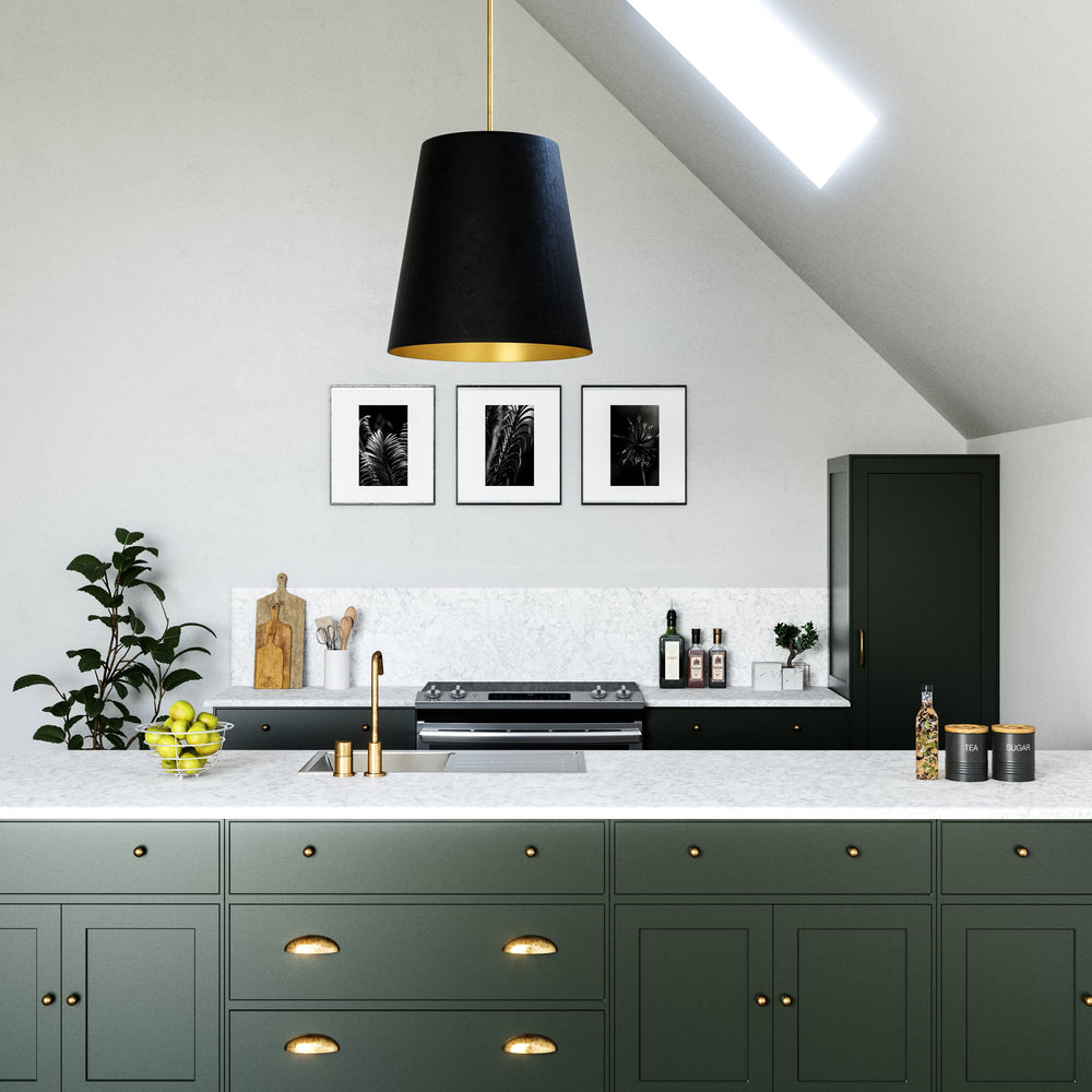 Modern kitchen with green cabinets, black appliances, and white countertops.