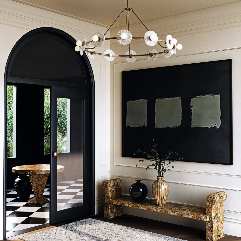 Contemporary entryway with a chandelier, black door, and abstract painting.