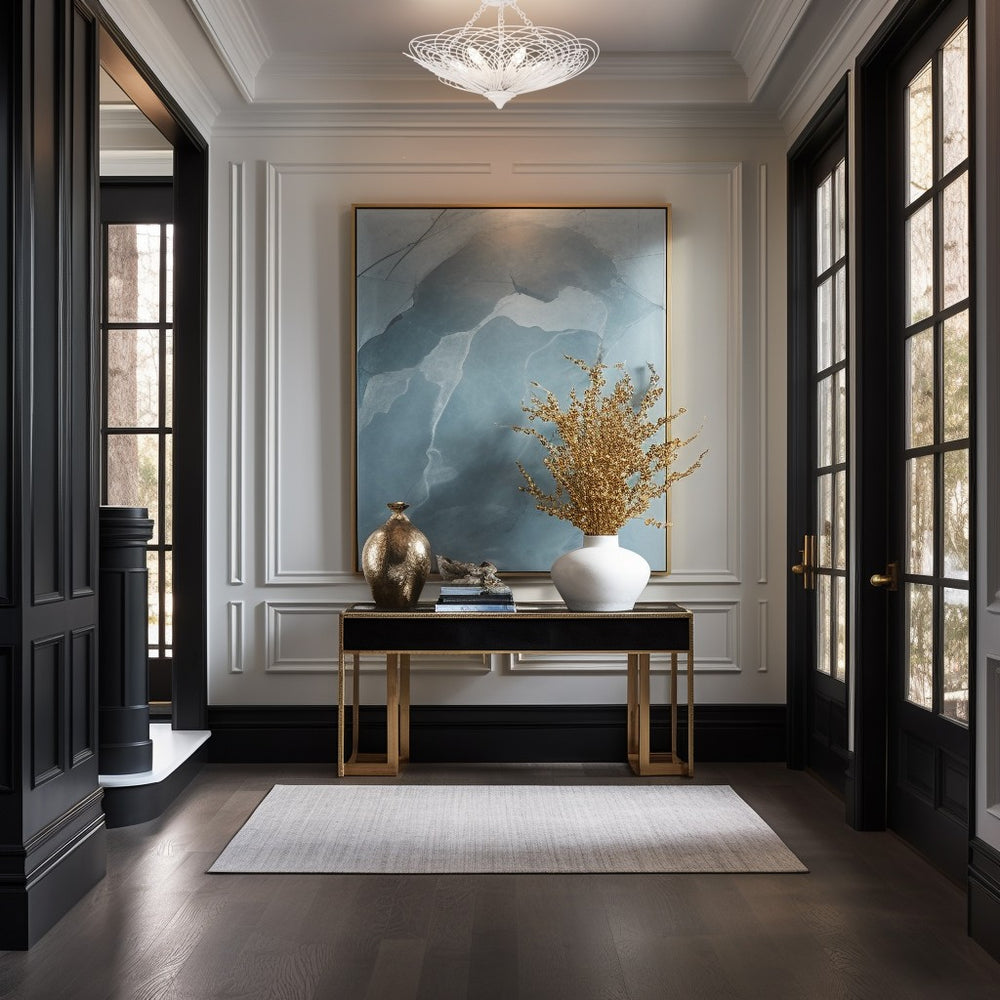 Elegant entryway with a console table, decorative vase, and abstract painting.