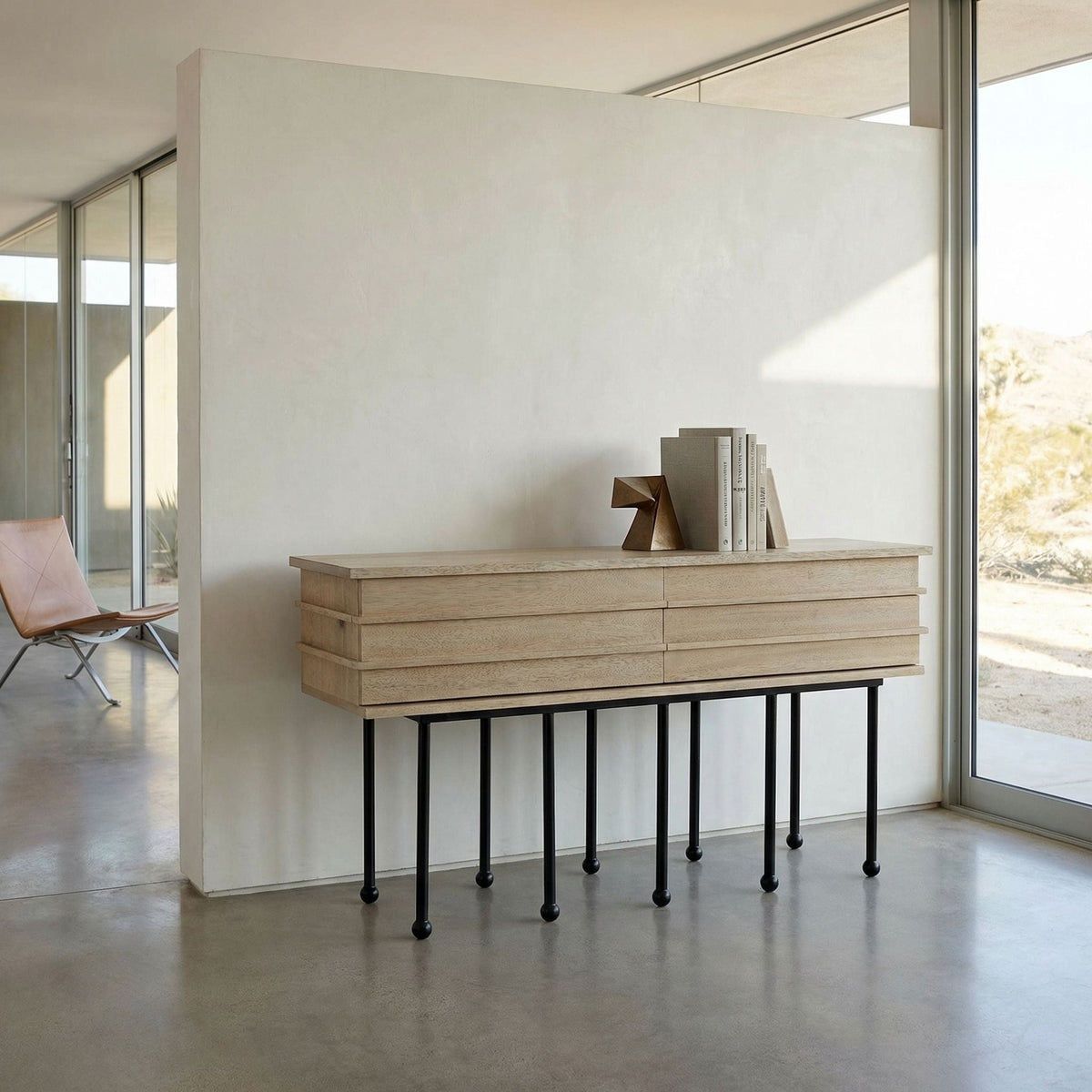 Noir Oliver Console Washed Walnut styled in an interior setting