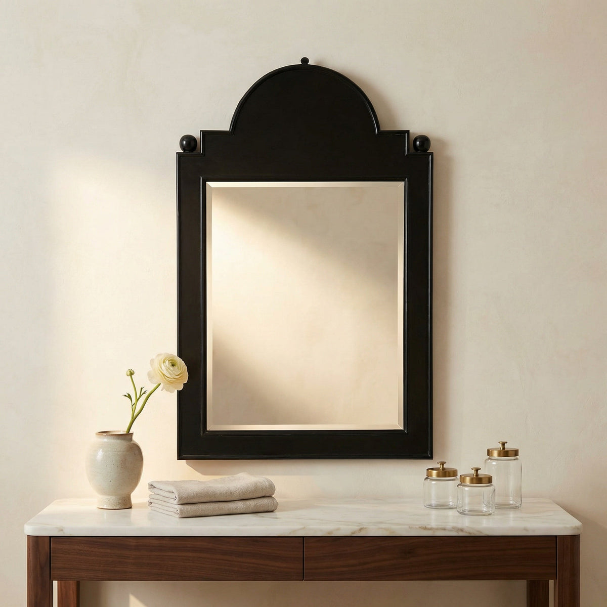Noir Jess Mirror Hand Rubbed Black styled in an interior setting