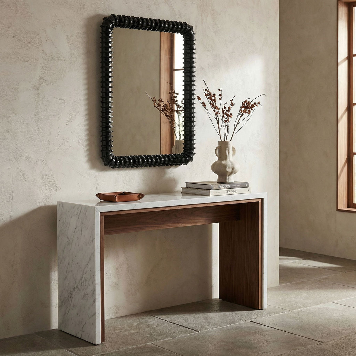 Noir Toshi Mirror Hand-Rubbed Black styled in an interior setting
