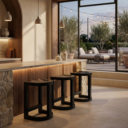 Noir Saddle Counter Stool Hand-Rubbed Black shown in a styled room setting