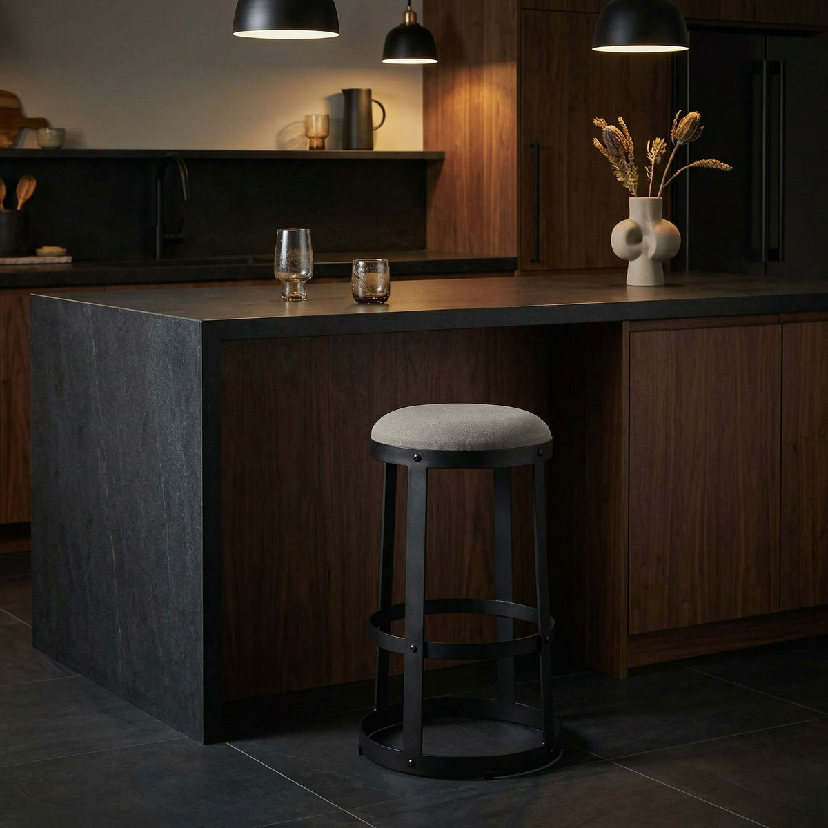 Noir Dior Bar Stool Matte Black, Tan styled in an interior setting