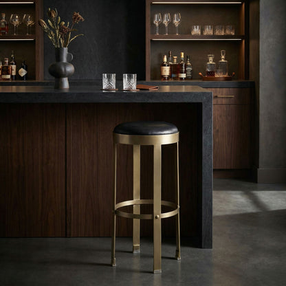 Noir Prince Bar Stool Antique Brass, Black styled in an interior setting