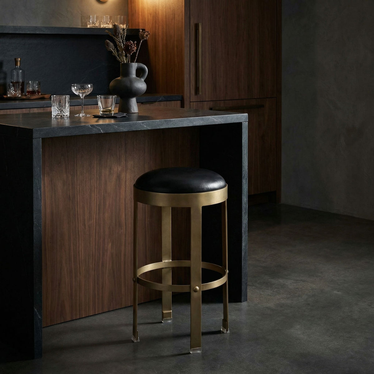Noir Prince Counter Stool Antique Brass, Black styled in an interior setting